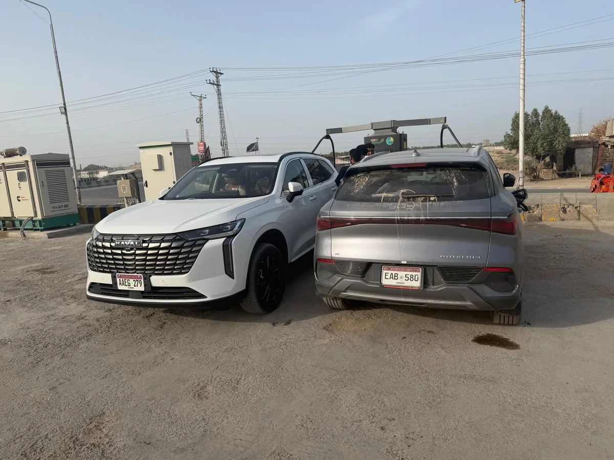 A Haval and the Atto 3 parked side by side sharing a charging station